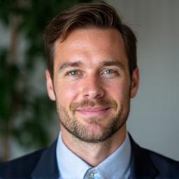 Professional headshot of Liam O'Connor, Music Editor.